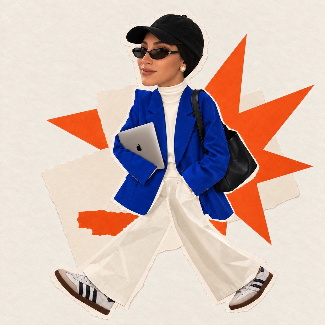 Myla, founder of mylagency, in a cobalt blazer holding an orange tag